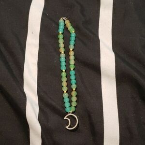 Elegant Green Beaded Necklace with Silver Crescent Pendant